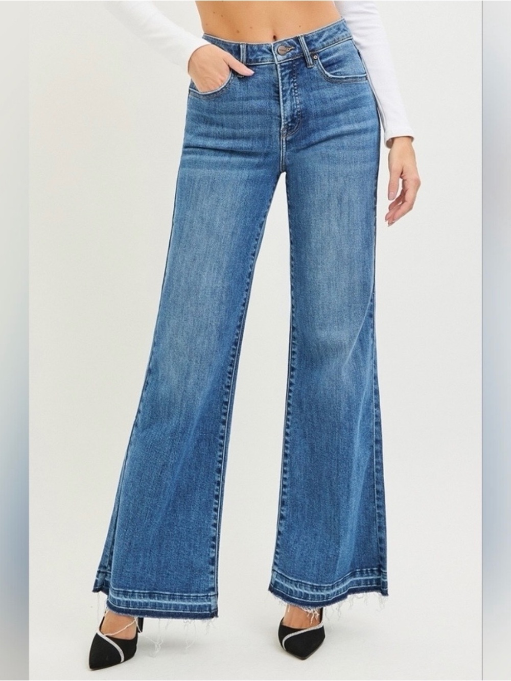 Risen high rise medium wash wide leg raw hem jeans, size 28